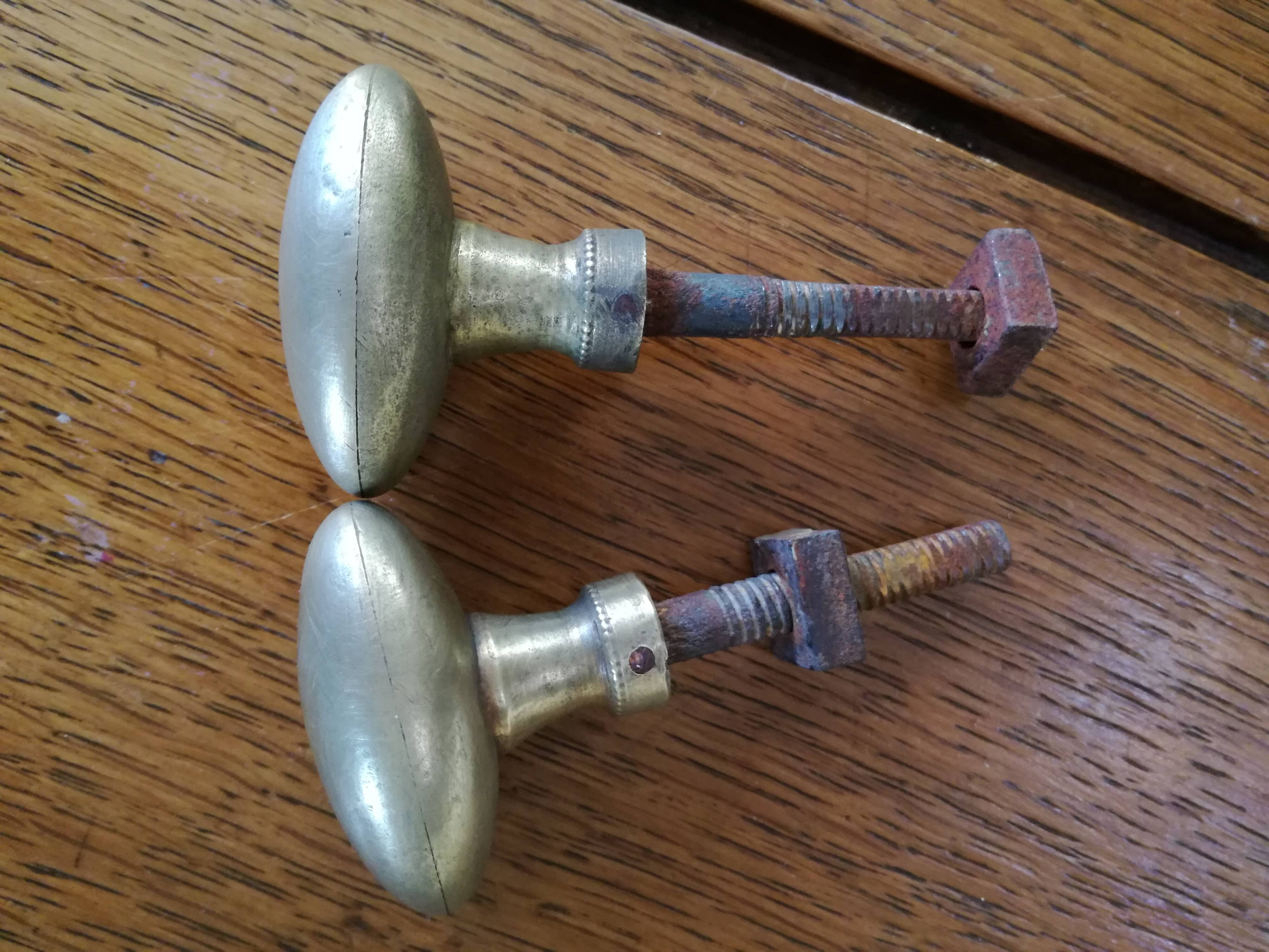 pair of old brass button handles