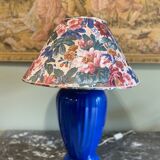 Large blue ceramic lamp with floral shade