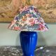 Large blue ceramic lamp with floral shade