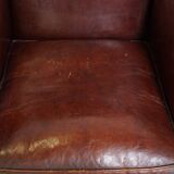 Subtle sheep leather armchair with a beautiful finish and a good patina