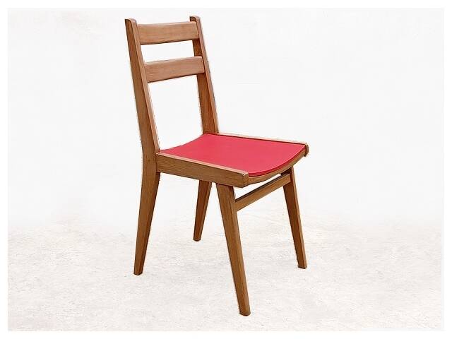 Vintage chairs from the 1950s in wood and faux leather.