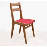 Vintage chairs from the 1950s in wood and faux leather.