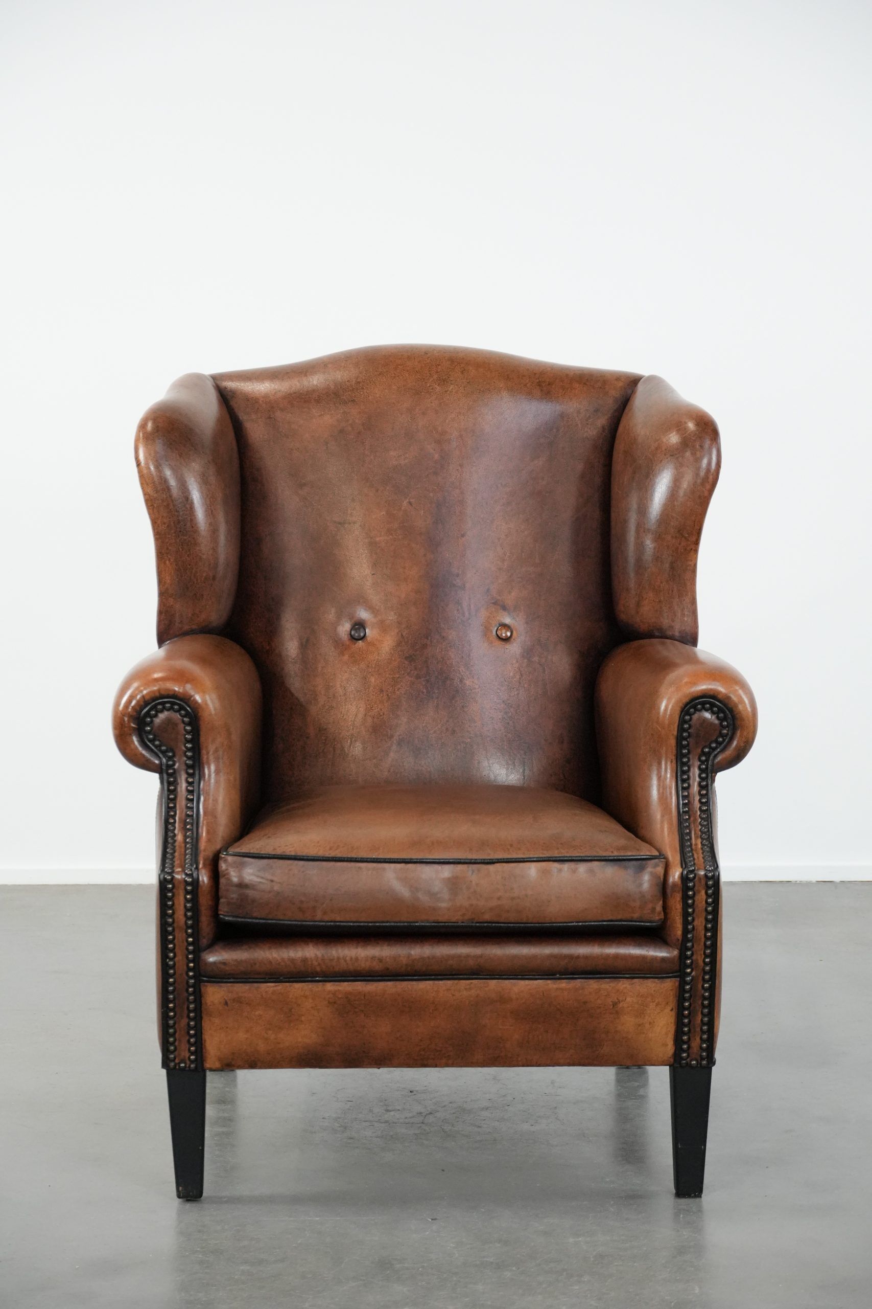 Timeless sheepskin wingback armchair with beautiful colours