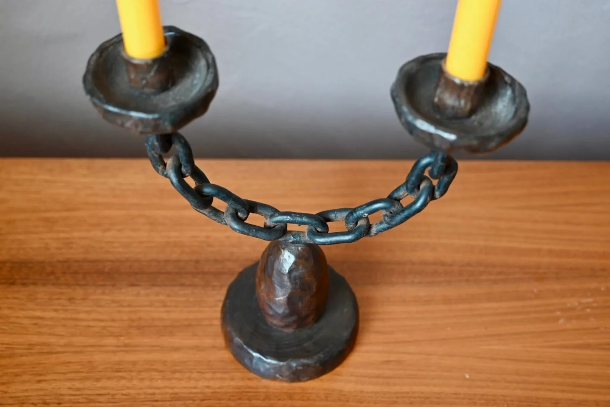 Sculpted wooden and wrought iron brutalist double chandelier from the 1960s.