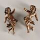 Pair of ancient cherubs in carved lacquered and gilded wood, Italy, 18th century.