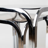 Pair of chrome nesting tables with smoked glass tops
