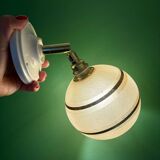 Vintage globe wall light in frosted yellow and gold glass.