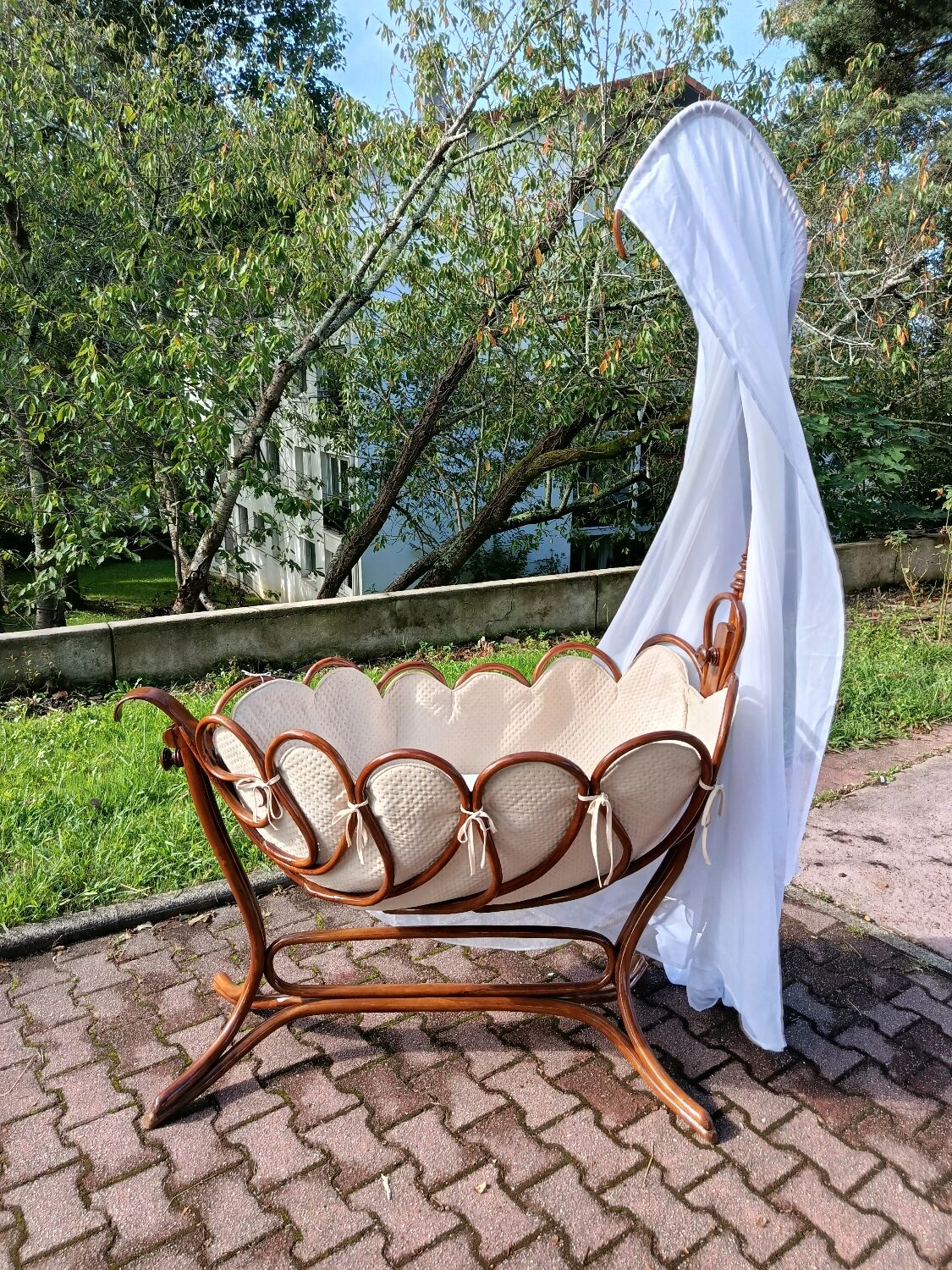 Antique cradle by J&J Khon