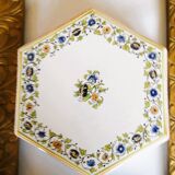 Hand-painted flat dish decorated in the Moustier style.