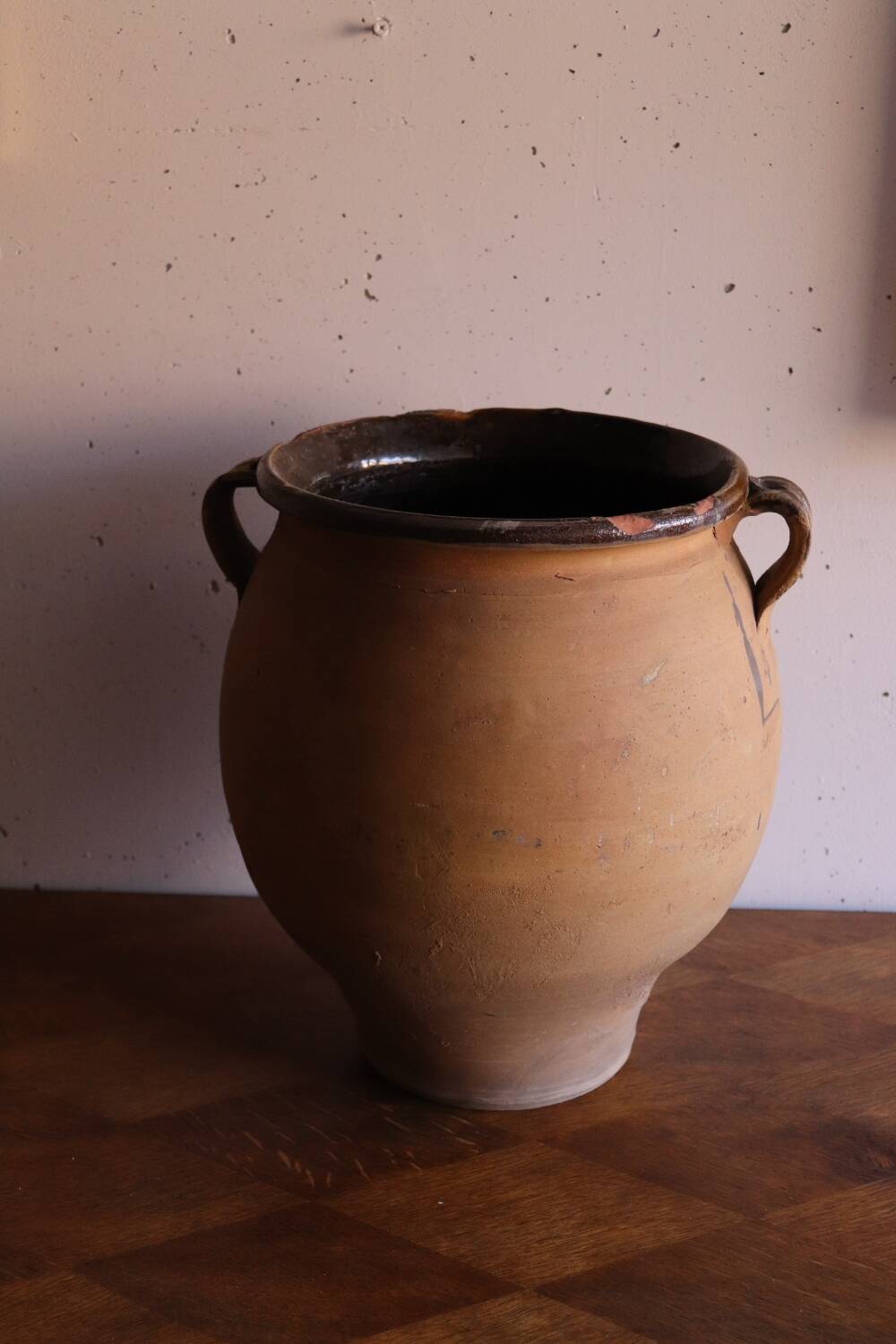 Old glazed terracotta olive jar