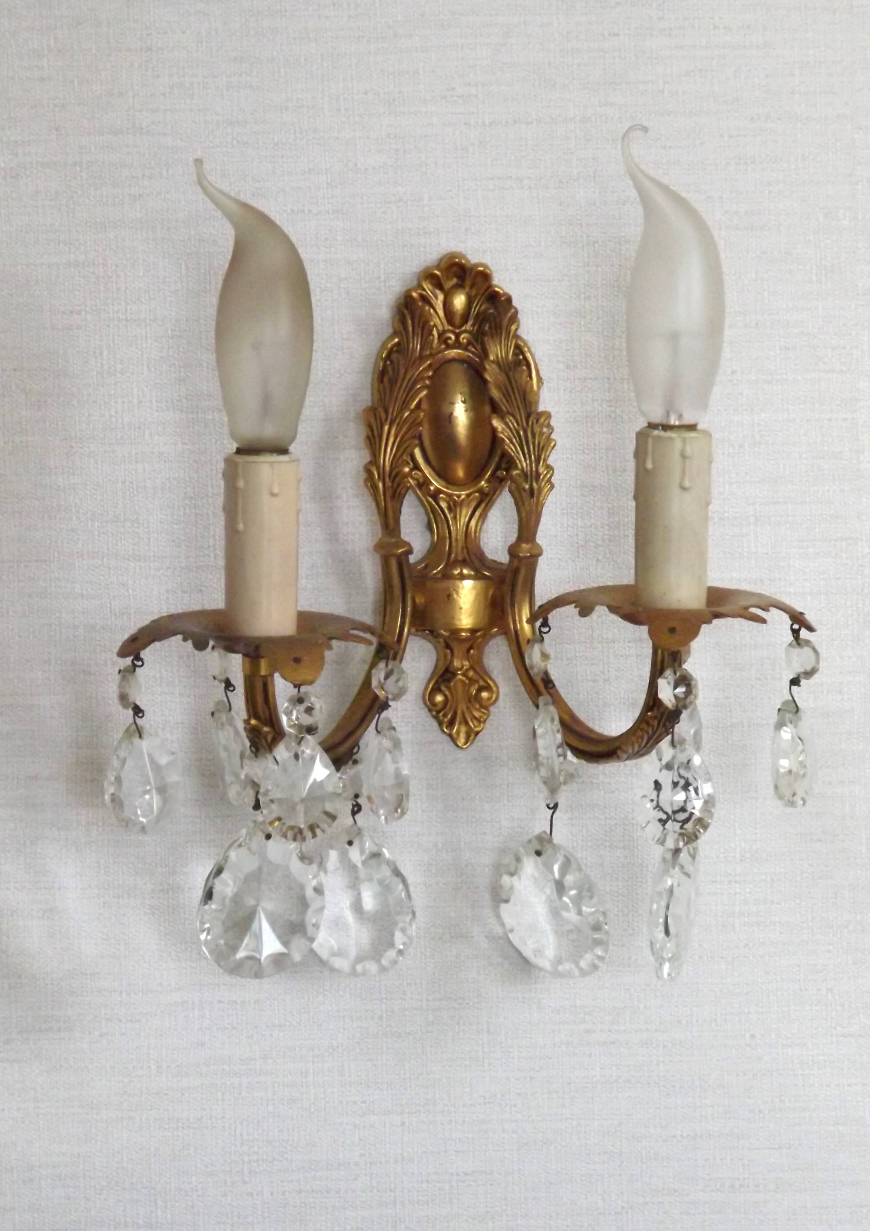 Pair of antique 2-light wall sconces in bronze with crystal pendants, Spain.