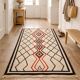 Ecru Berber rug with diamond patterns in structured Atlas style.