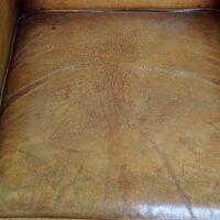 Set of English style light cognac colored leather armchairs.