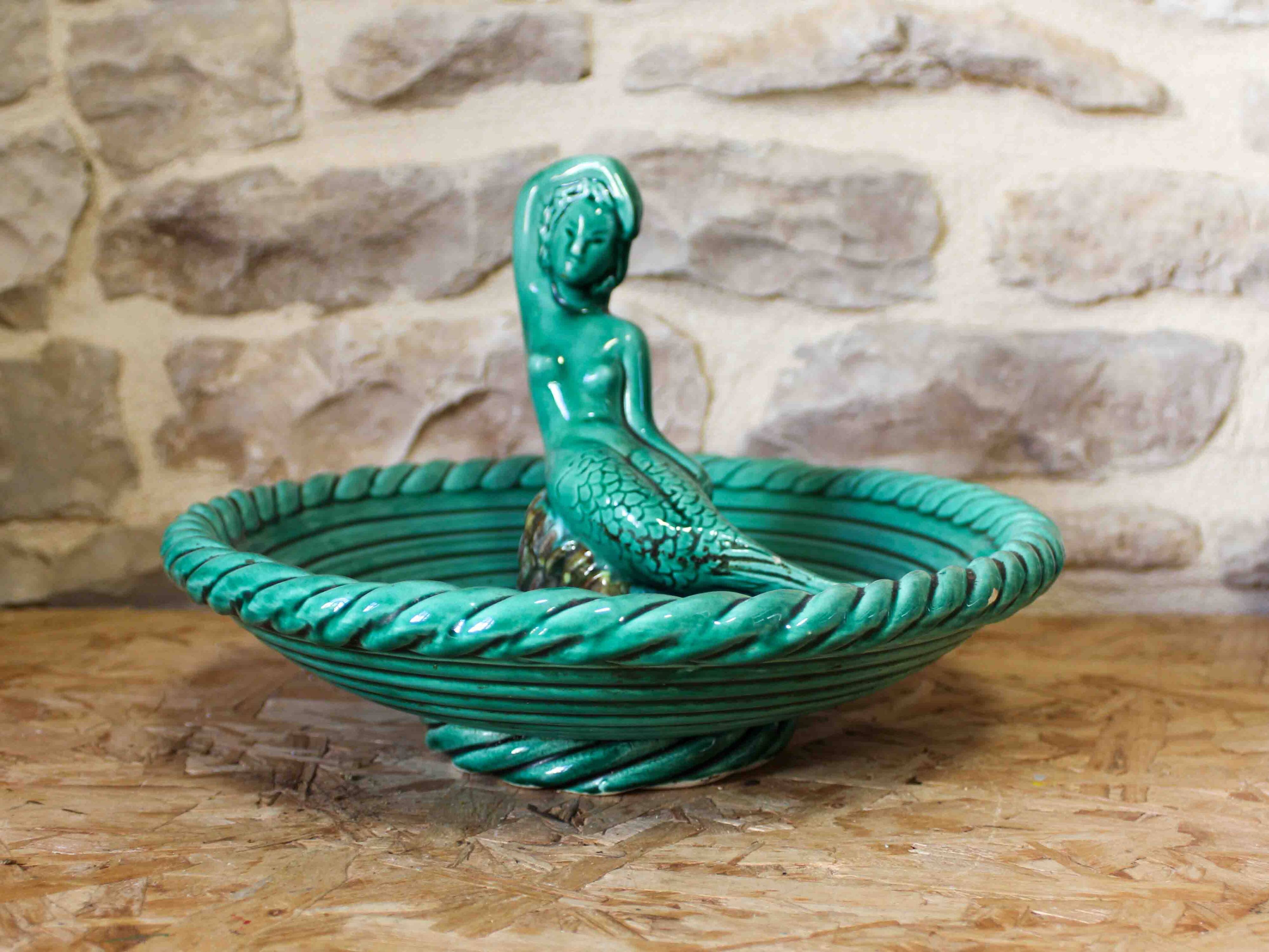 Ceramic cup with mermaid decoration
