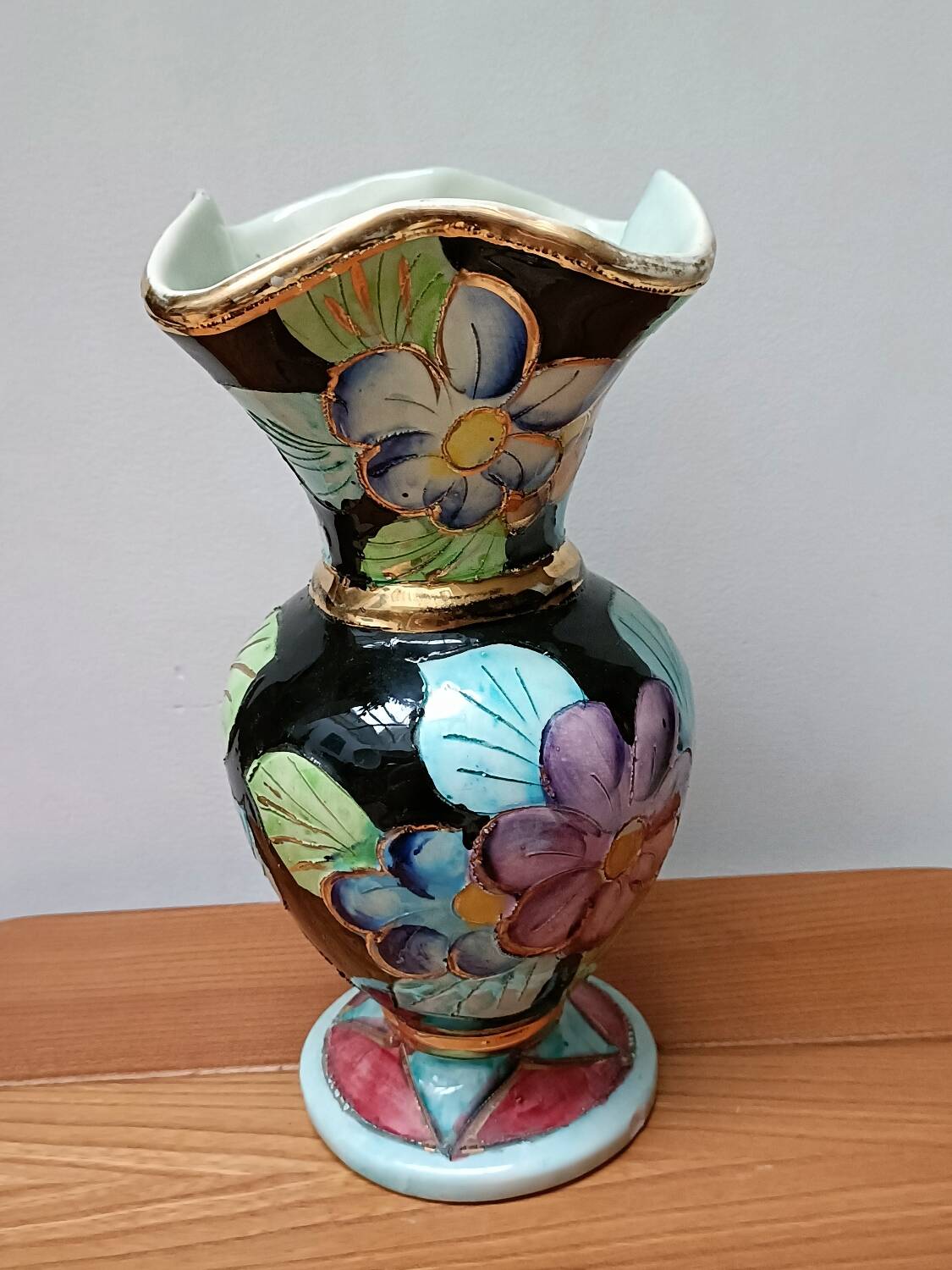 Vallauris vase flowers on black background