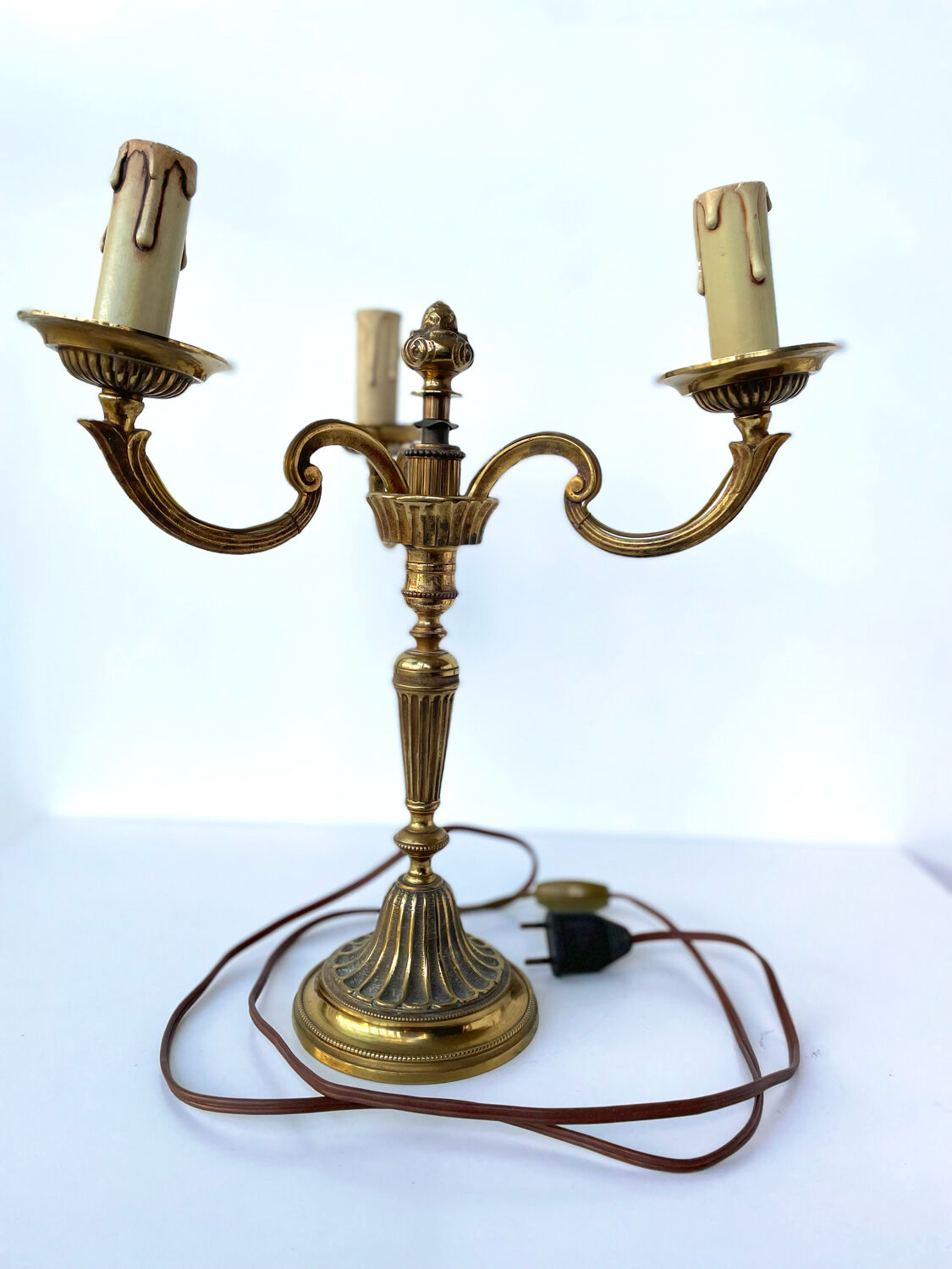 Three-branched golden candlestick