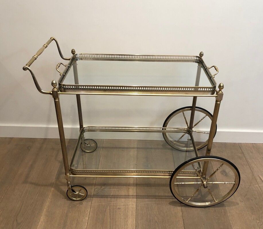 Neoclassical style rolling table in silvered brass
