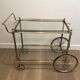 Neoclassical style rolling table in silvered brass