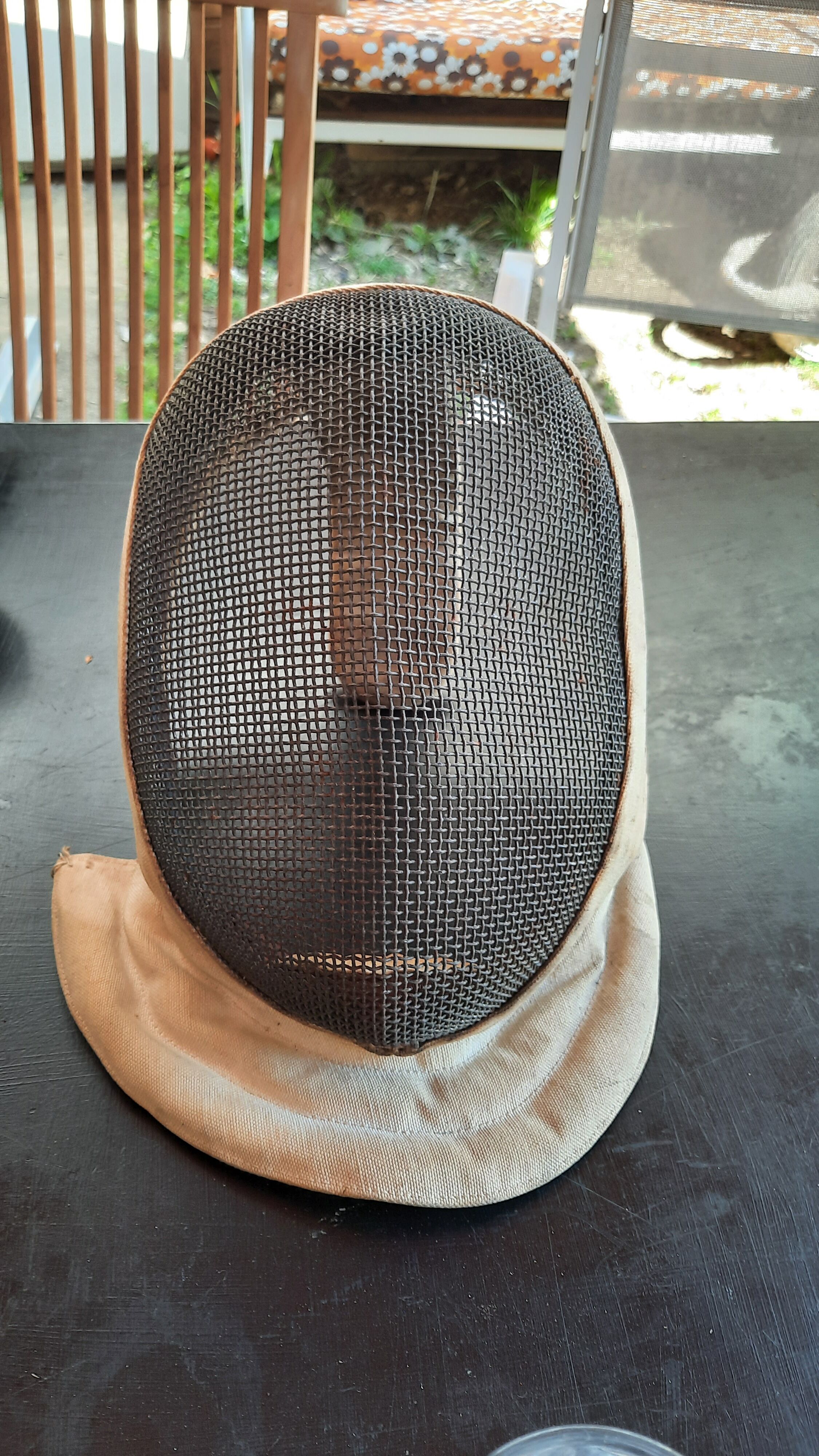 Pair of old fencing mask and foil