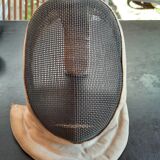 Pair of old fencing mask and foil