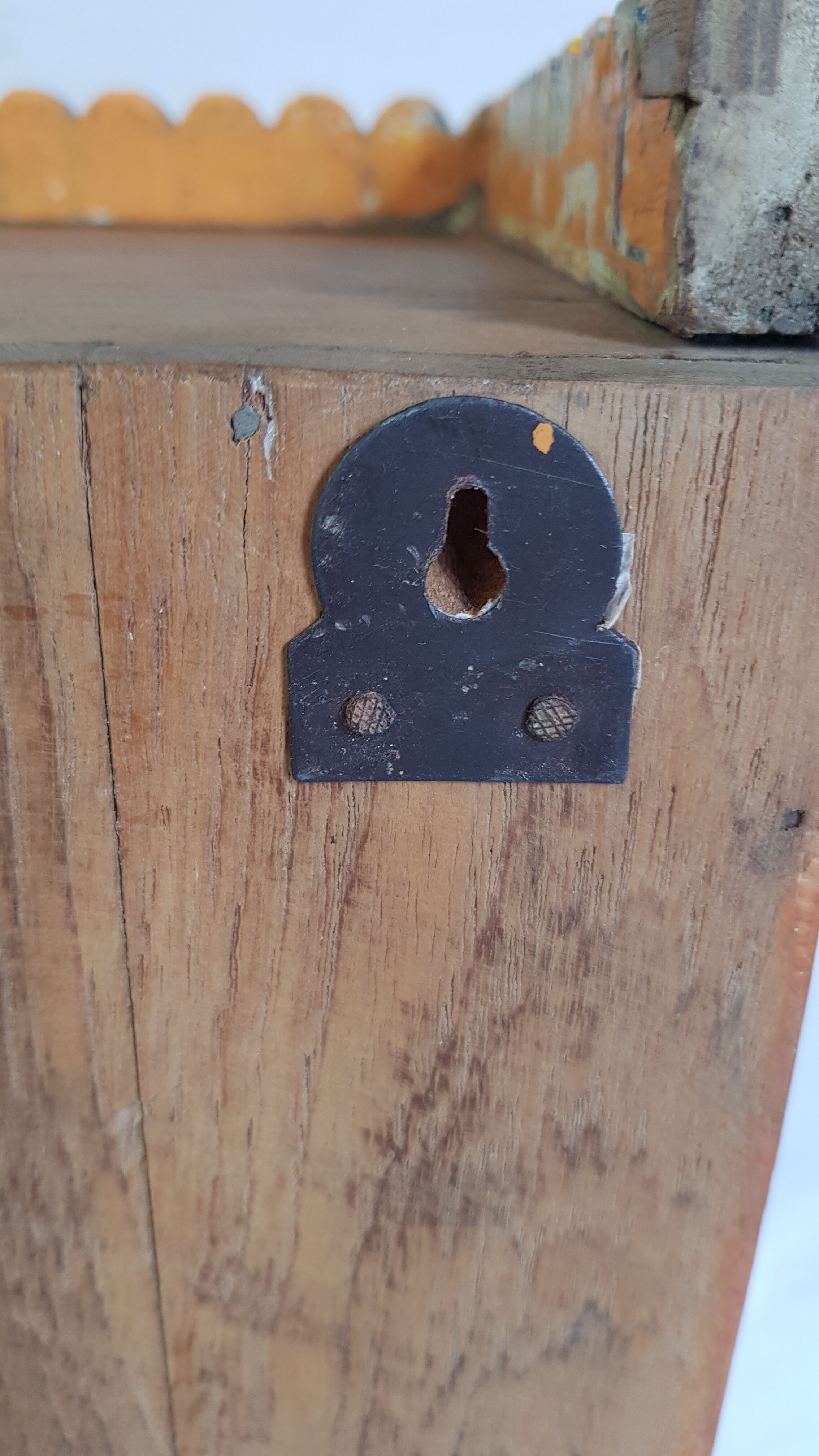 Old temple-showcase with teak offerings