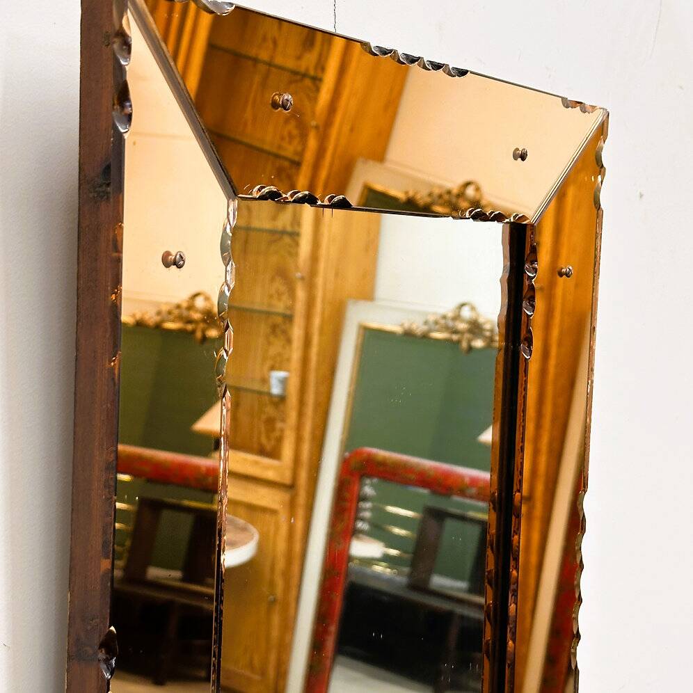 Striking French amber-coloured mirror with sculpted edge details, 1940s