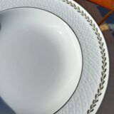Twelve white porcelain plates