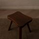 Vintage wooden stool in organic shape