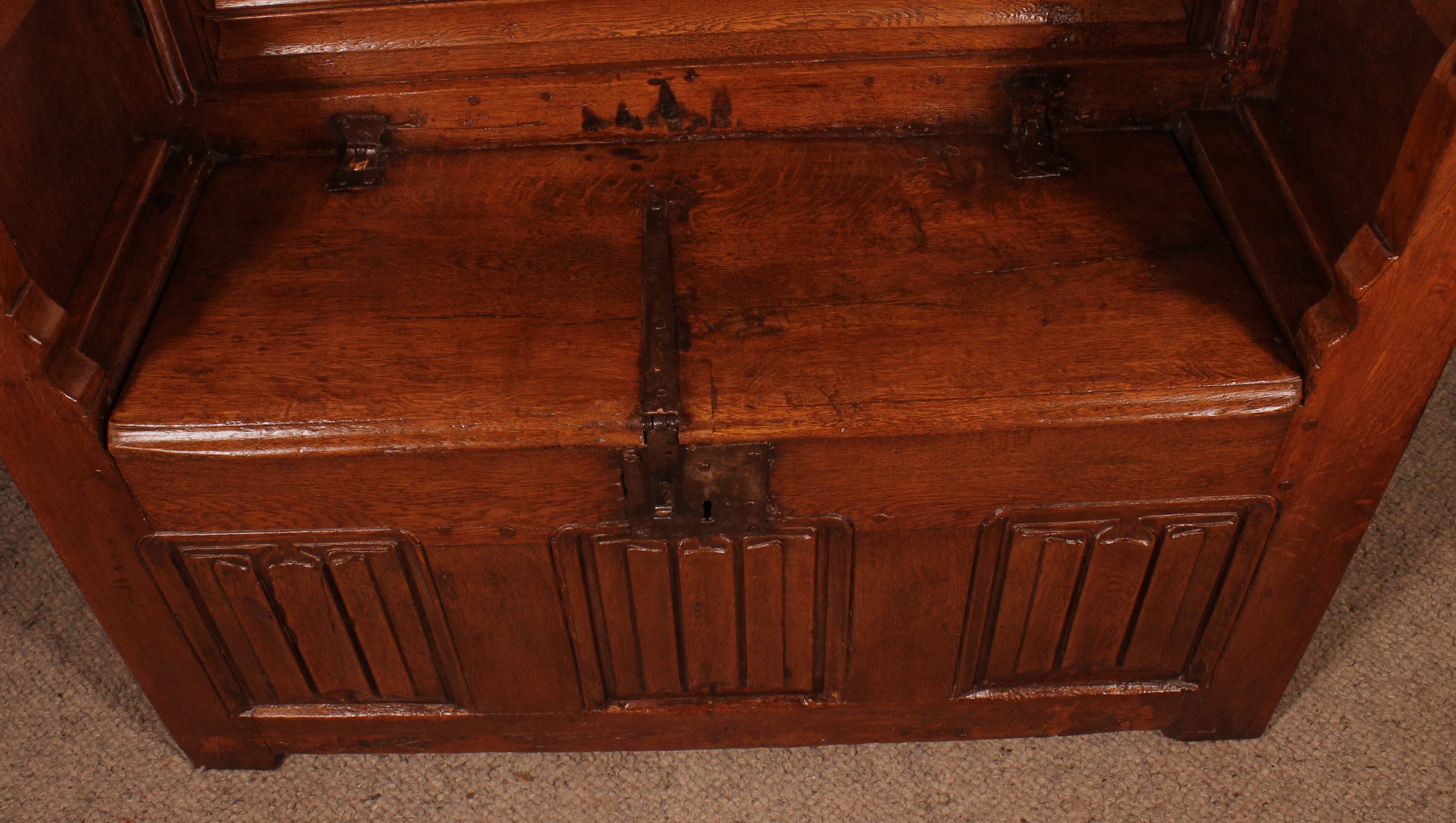 Oak bench chest with incorporated panels and gothic elements