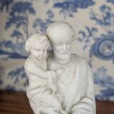 Statue of Saint Joseph and the infant Jesus in biscuit porcelain, early 20th century