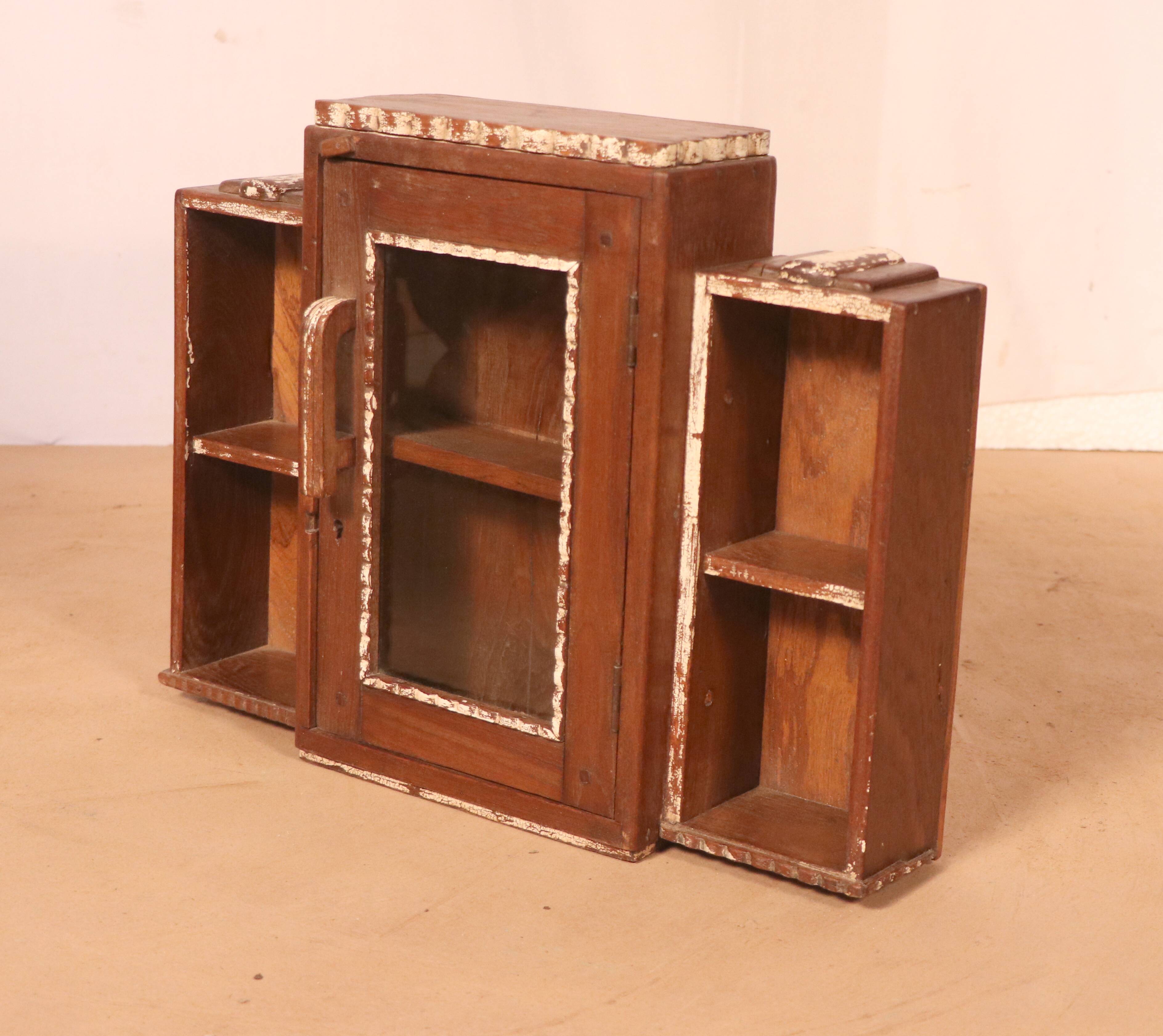 Old art deco showcase in burmese teak with original white edging