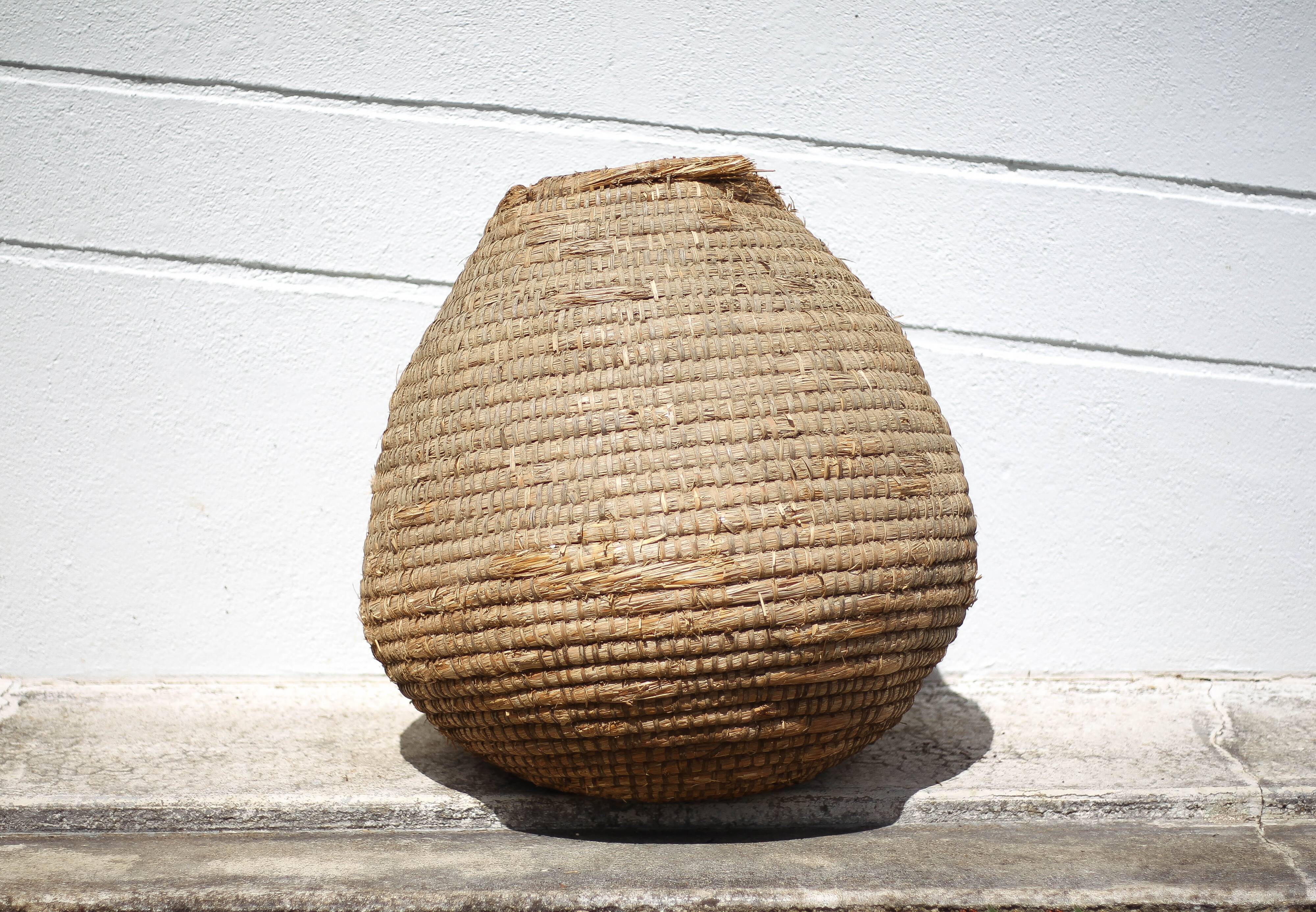 Old basket, burgundy straw and bramble, woven basket, interior decoration, pantry, flowerpot