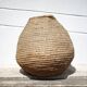 Old basket, burgundy straw and bramble, woven basket, interior decoration, pantry, flowerpot