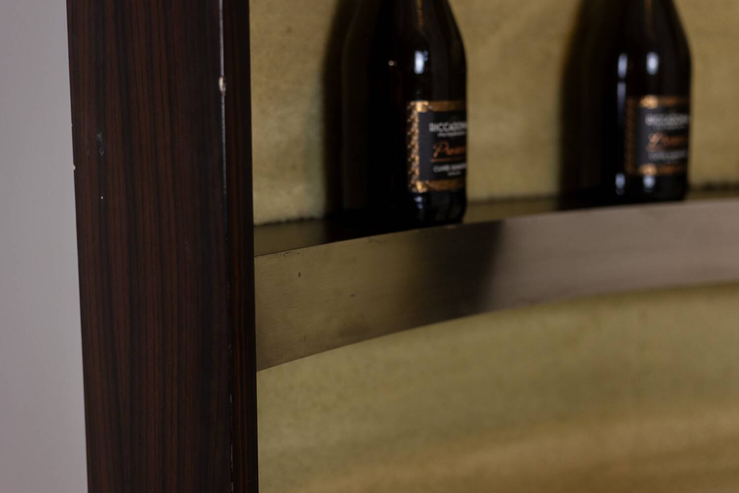 Circular bar in brushed metal, wood and carpet. 1970s.