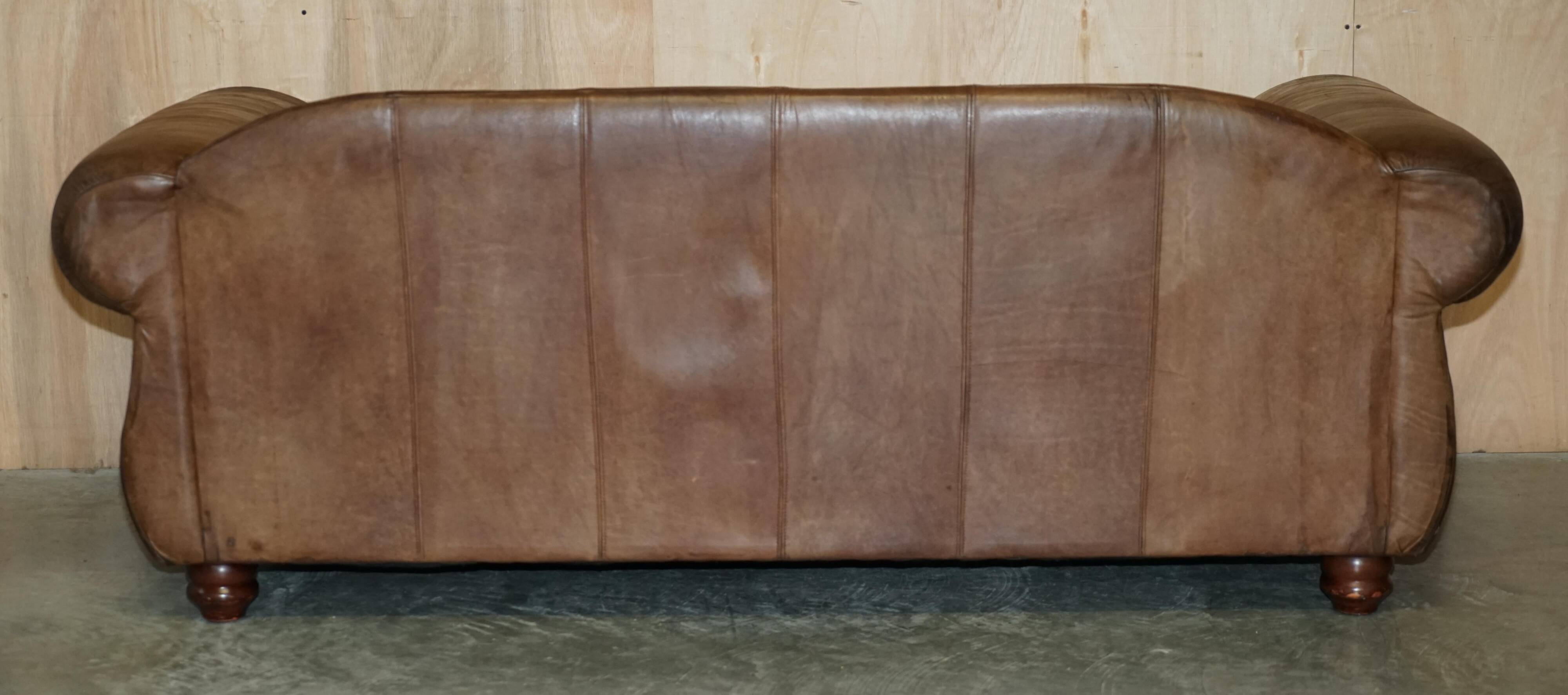Vintage leather sofas by Thomas Lloyd with Kilim cushions.