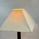Vintage table lamp with a square wooden column and brushed steel base.