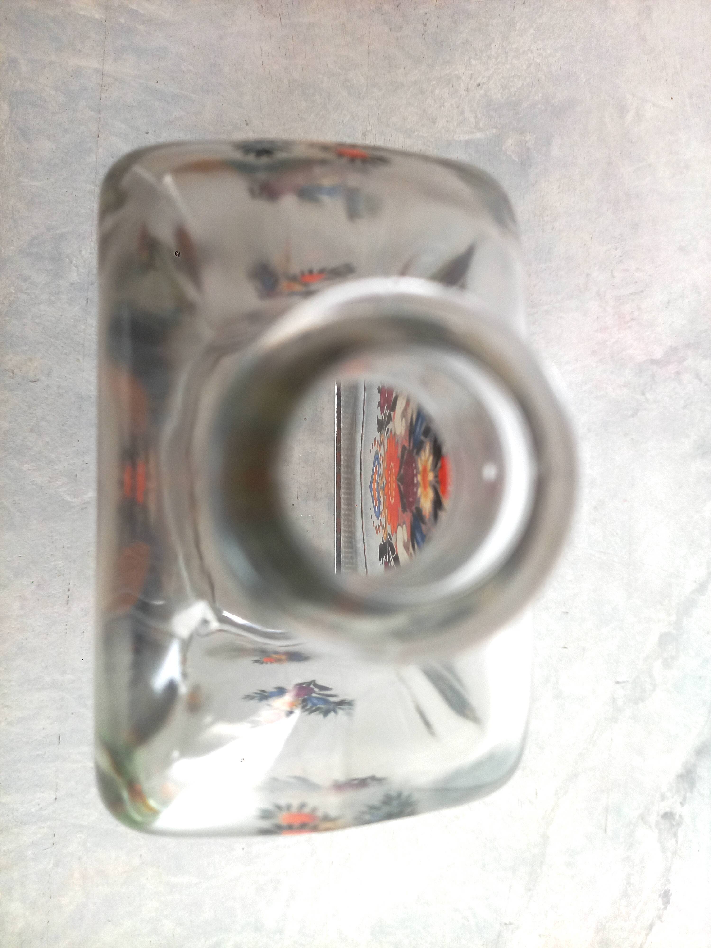 Bottle with folkloric decoration of flowers and birds inspired by Eastern countries