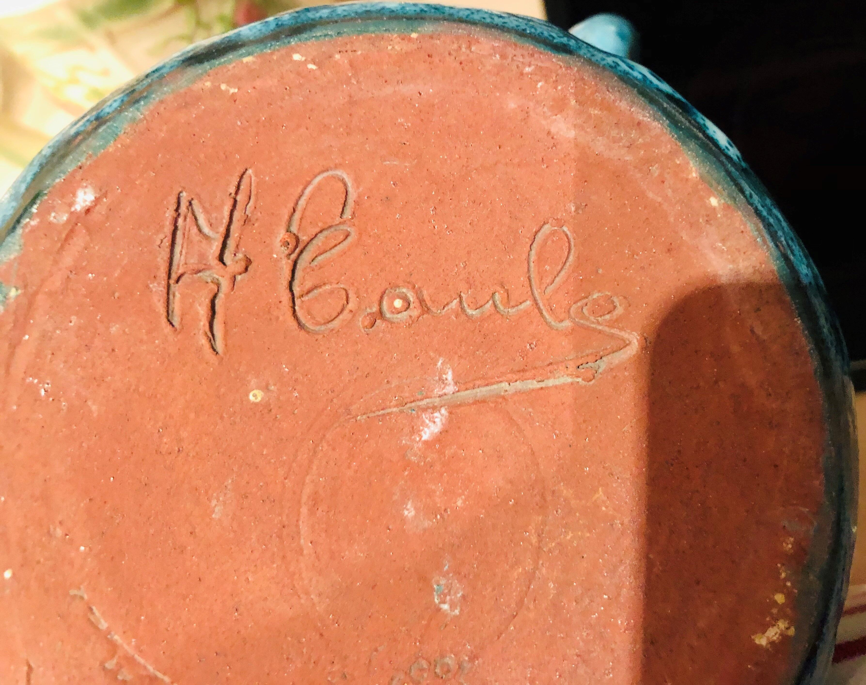 Old pitcher in terracotta signed