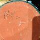 Old pitcher in terracotta signed