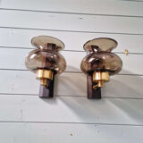 Pair of wall sconces in brass and smoked glass, 1960s.
