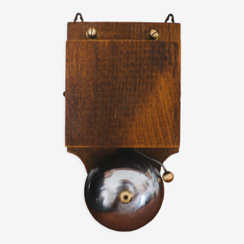 Antique doorbell in wood and iron