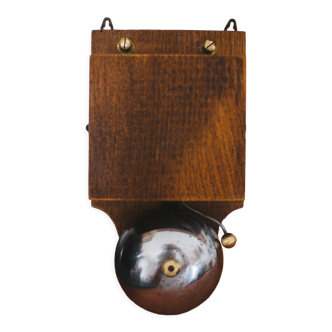 Antique doorbell in wood and iron