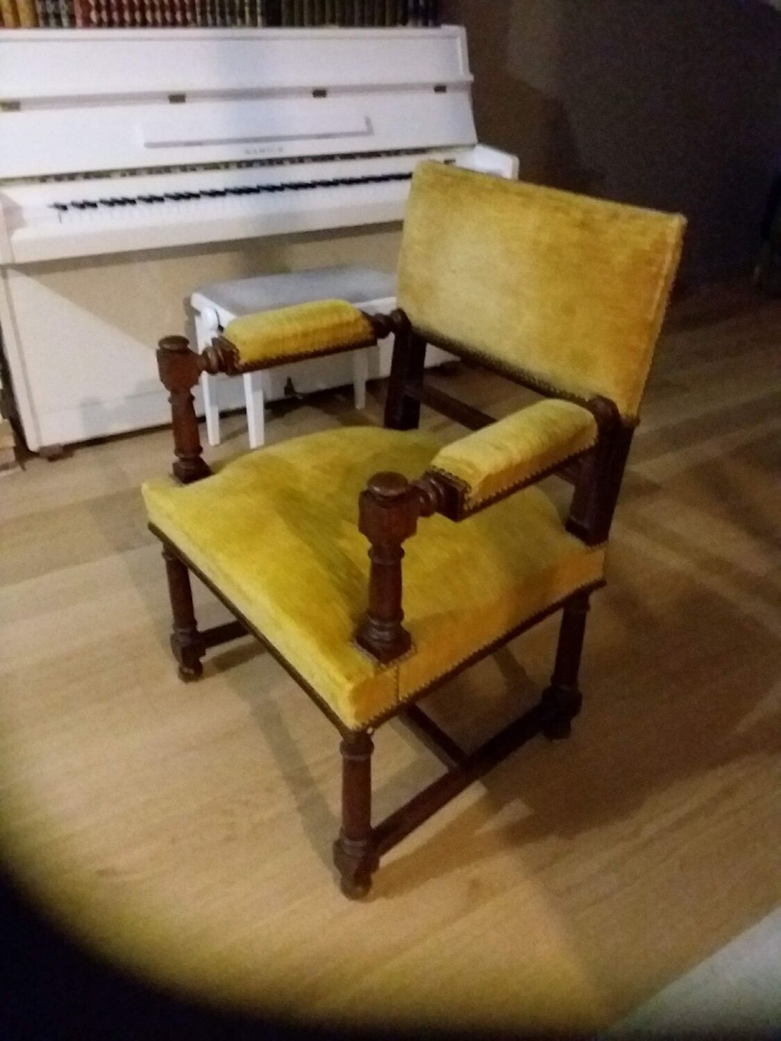 Mustard yellow wooden and velvet armchair