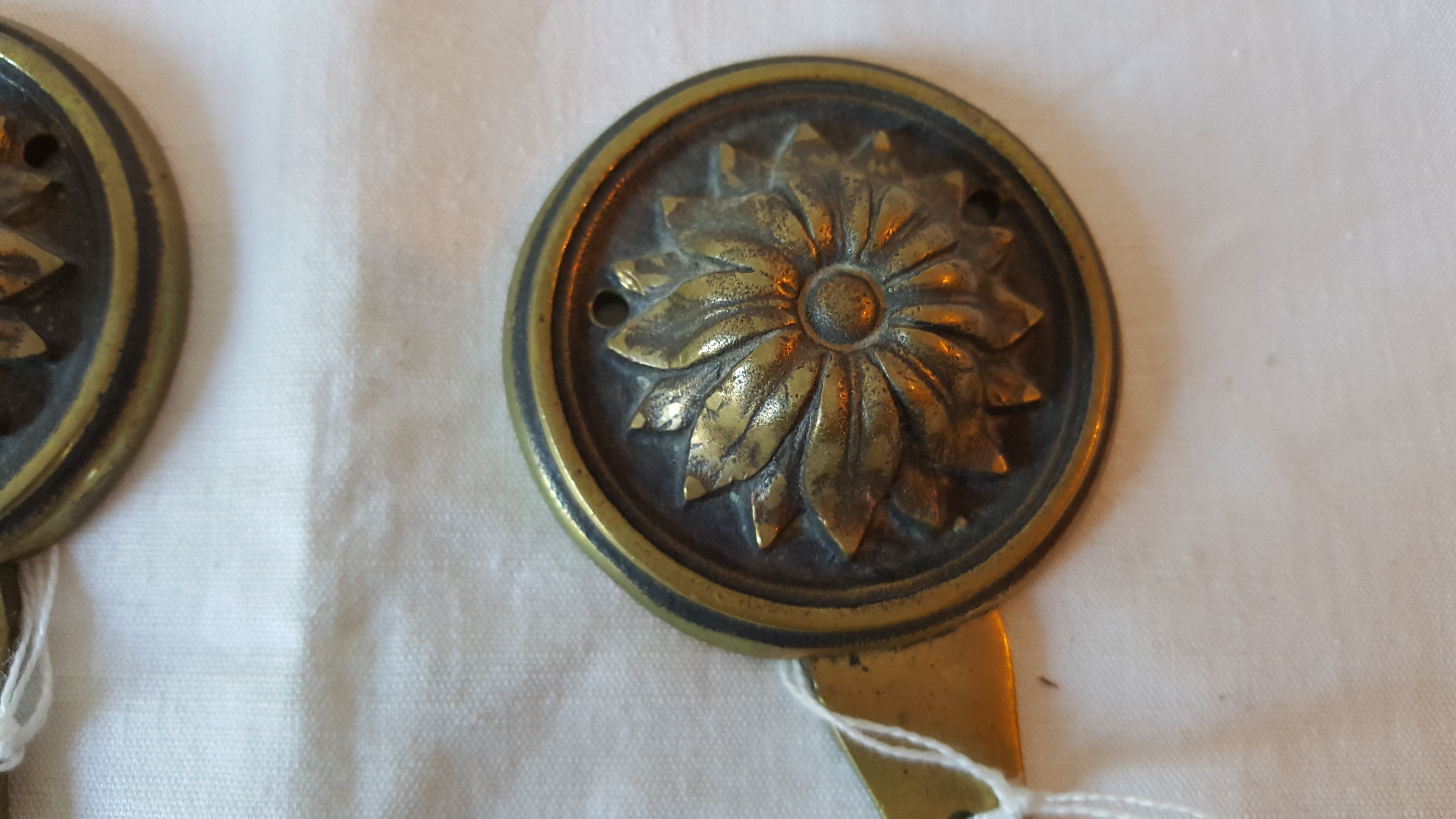 Brass patères
