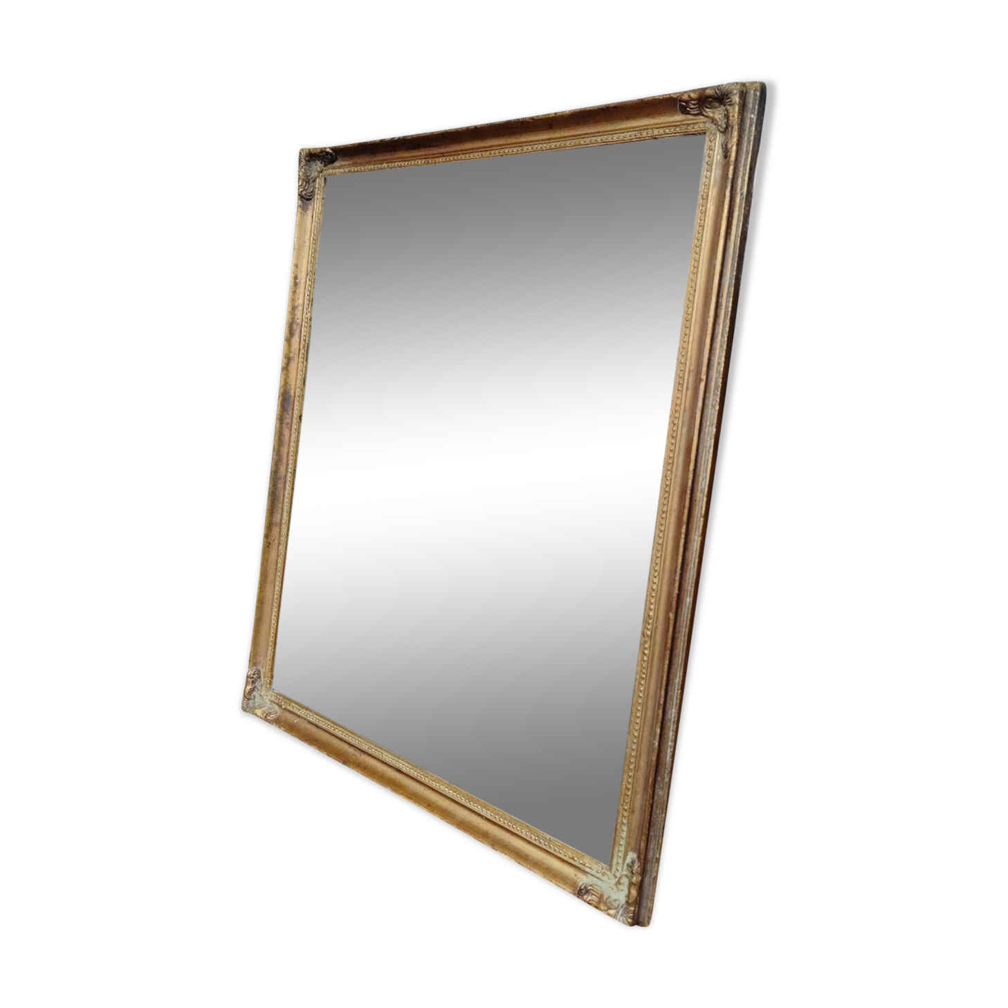 Miroir en bois, doré à la feuille d'or.