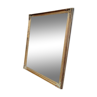 Wooden mirror, gilded with gold leaf.