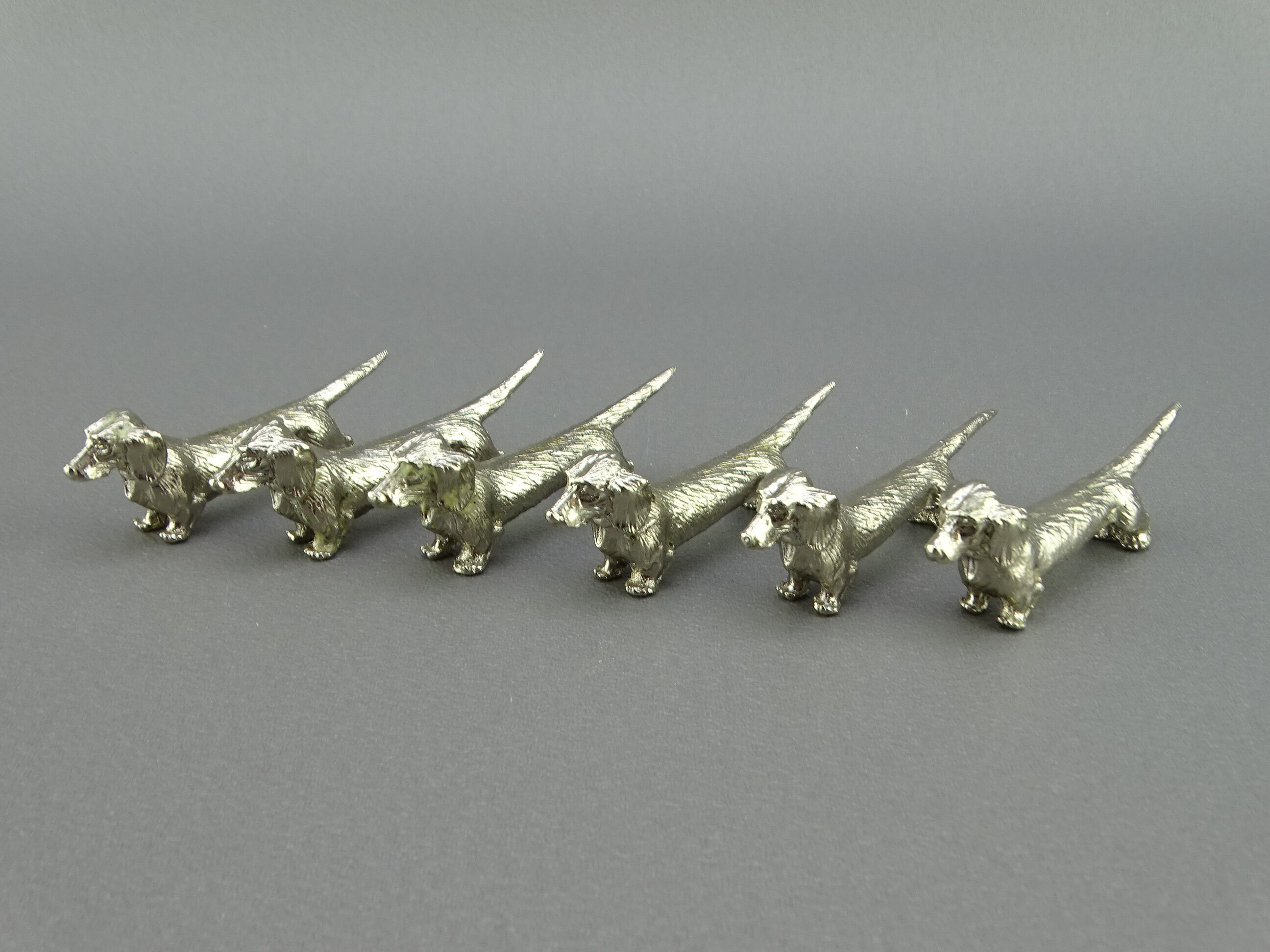 Set of 6 silver metal knife holders with basset dachshund dogs