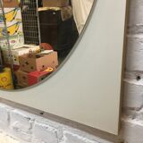 Round mirror on laminated support
