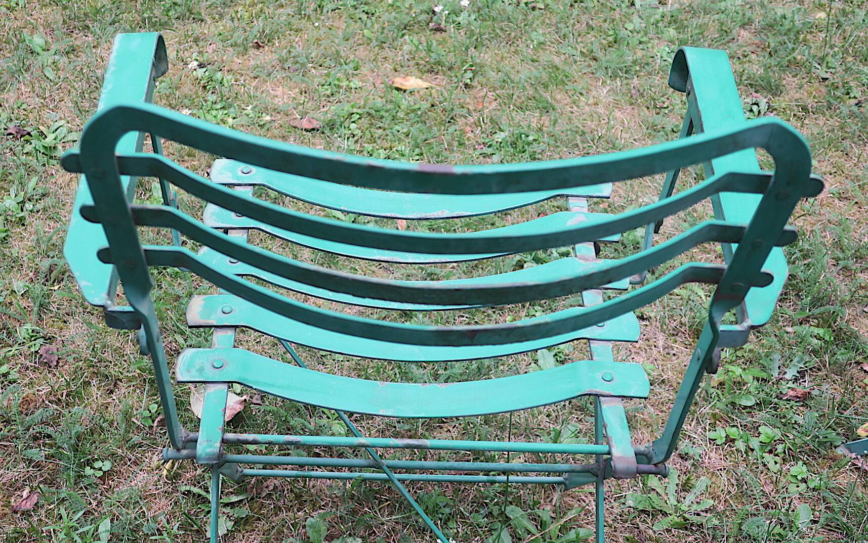 Pair of mid century distressed painted iron garden chairs