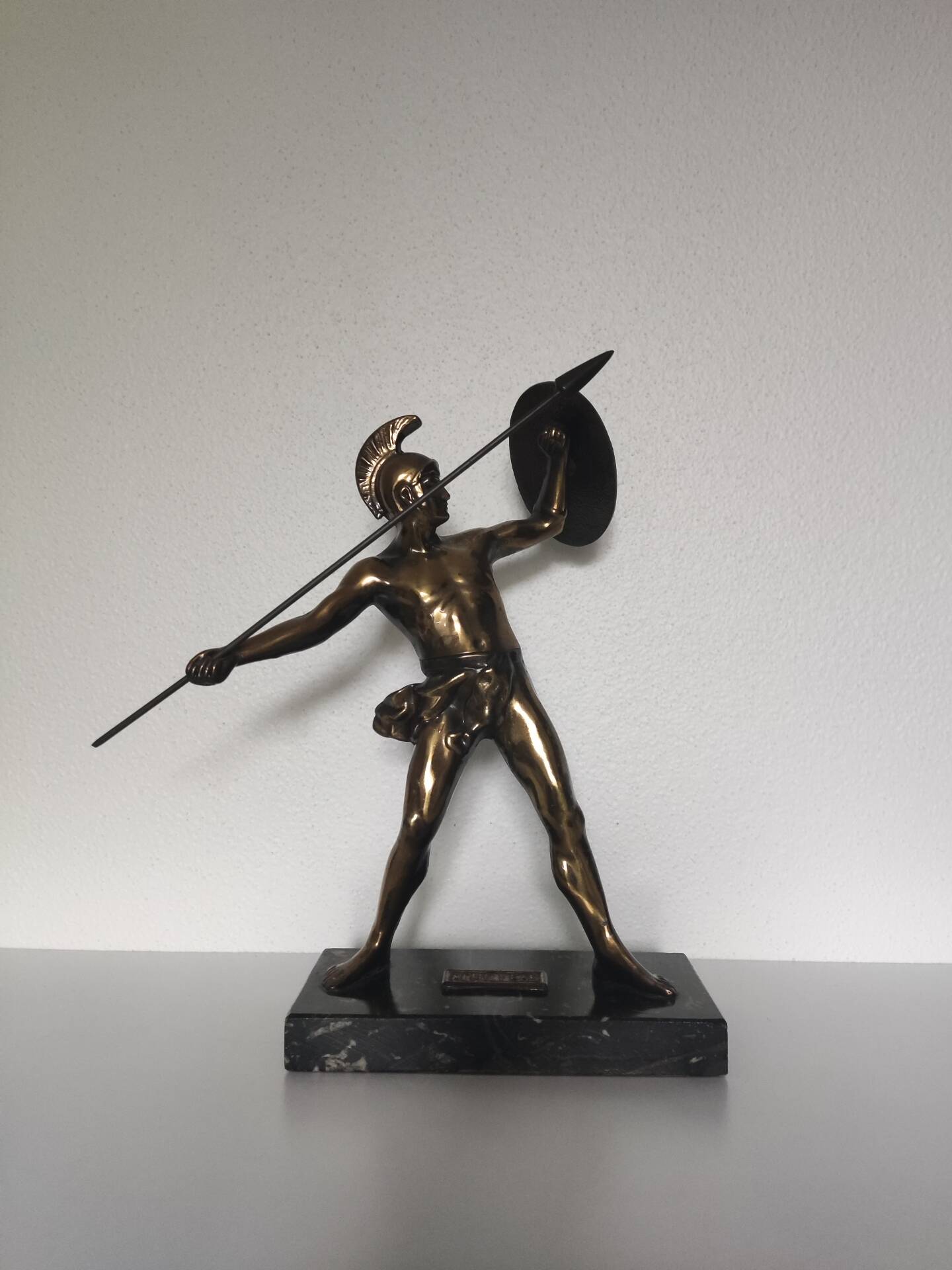 Large statue of Achilles, Greek warrior, marble base, ancient mythology.